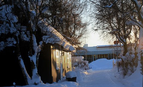 Sun shines on Eyrarlandstofu as the days get shorter